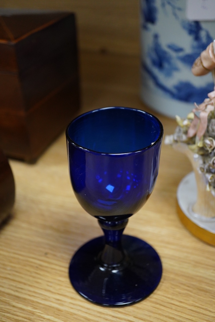 Sundry porcelain comprising three German figures, a Royal Worcester blush ivory ewer and a mug, together with a blue wine glass, largest 26cm high